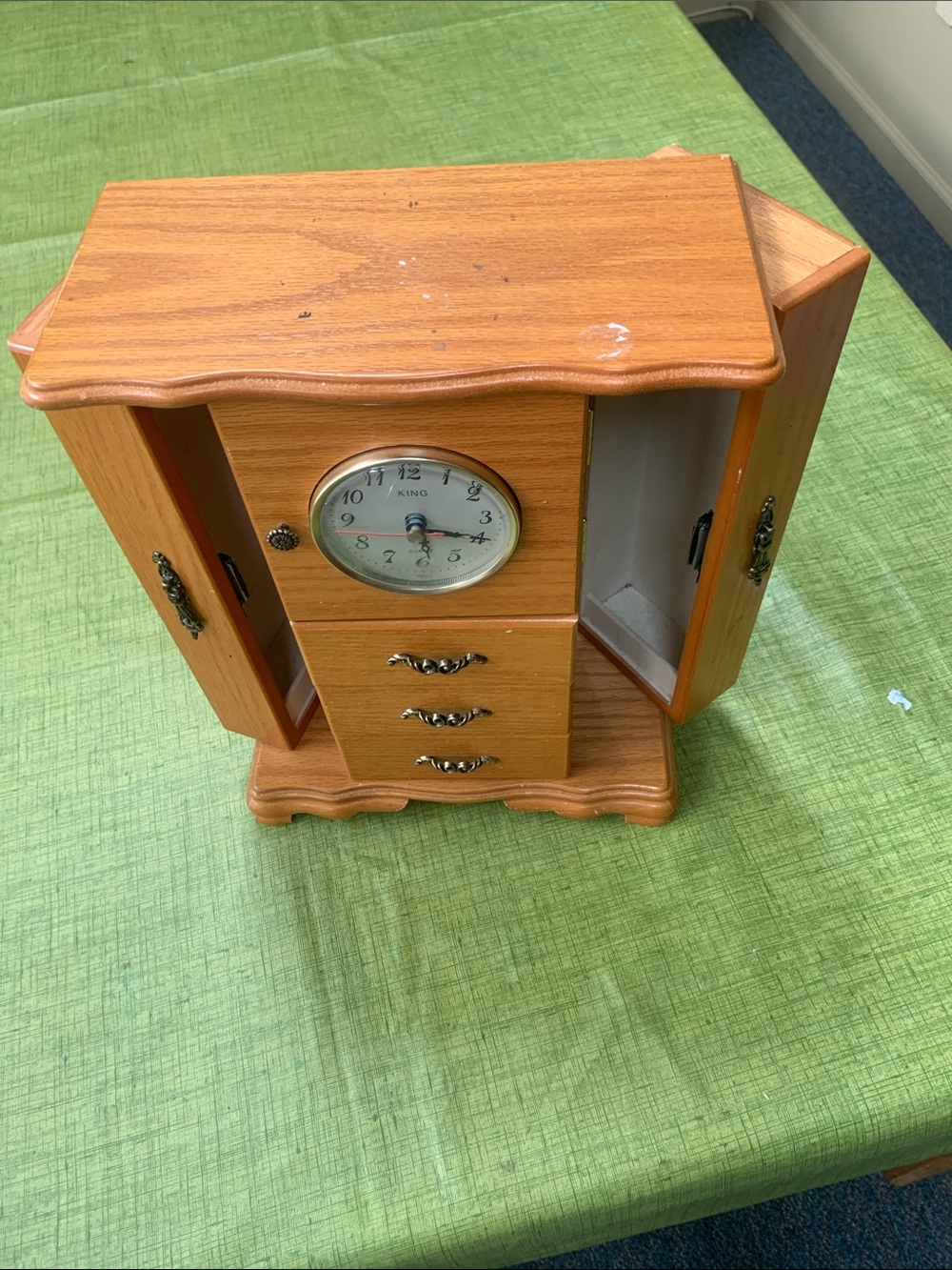 Wood-Tone Jewelry Cabinet Wall Clock with Built-In Clock